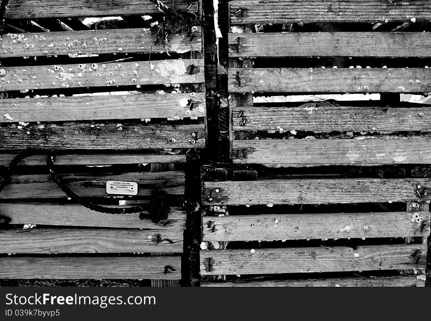 Black and white of old wooden shipping crates.