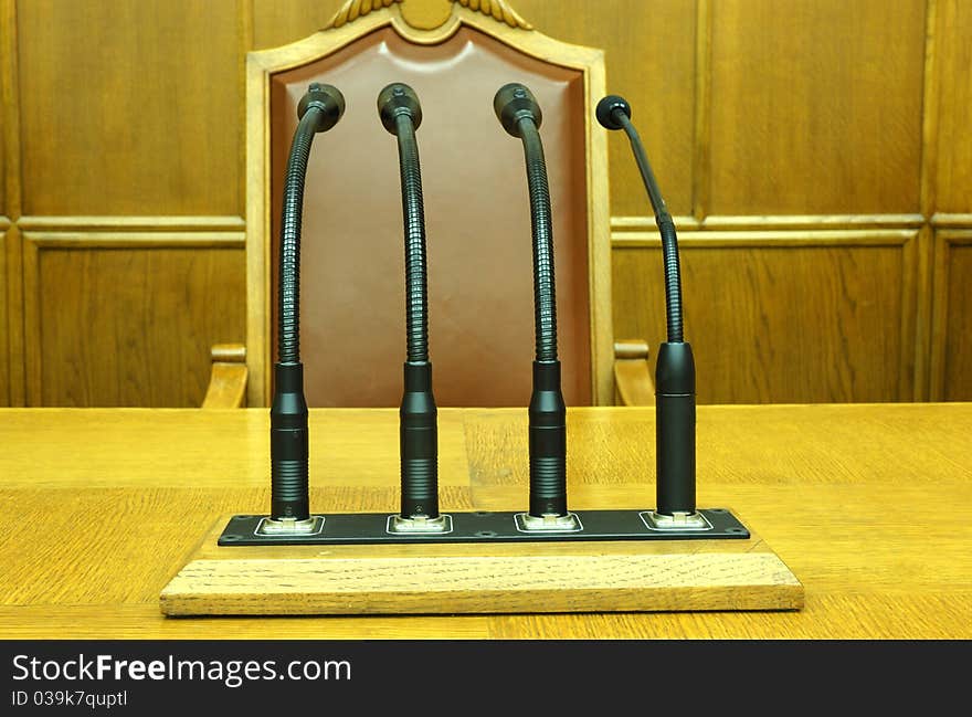 Photo of microphones in empty conference room