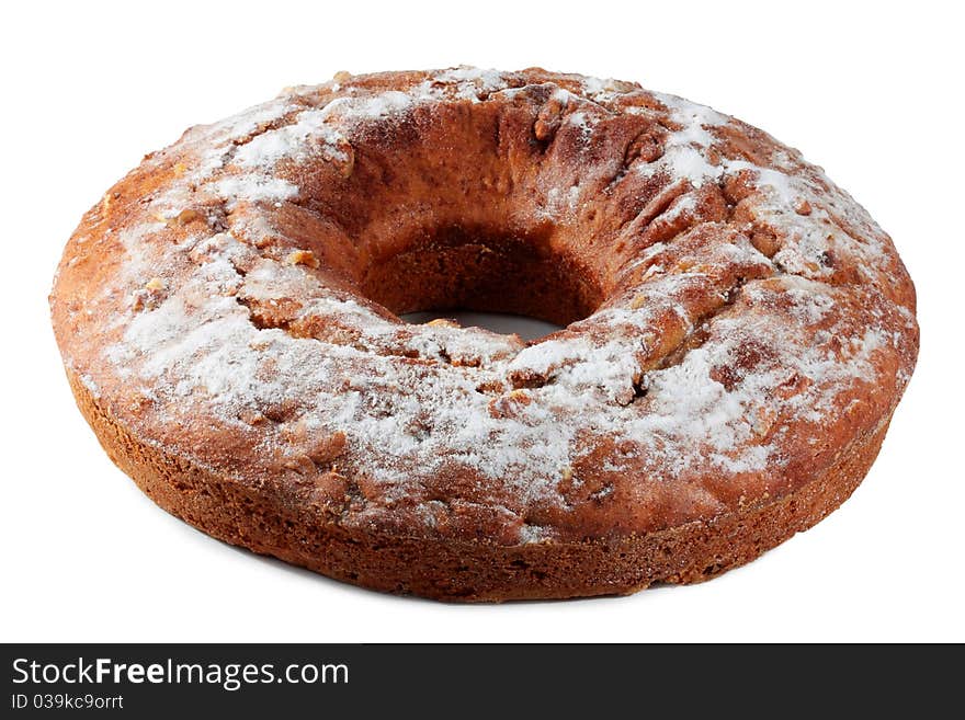 Cake with nuts, dusted with icing sugar isolated on a white background