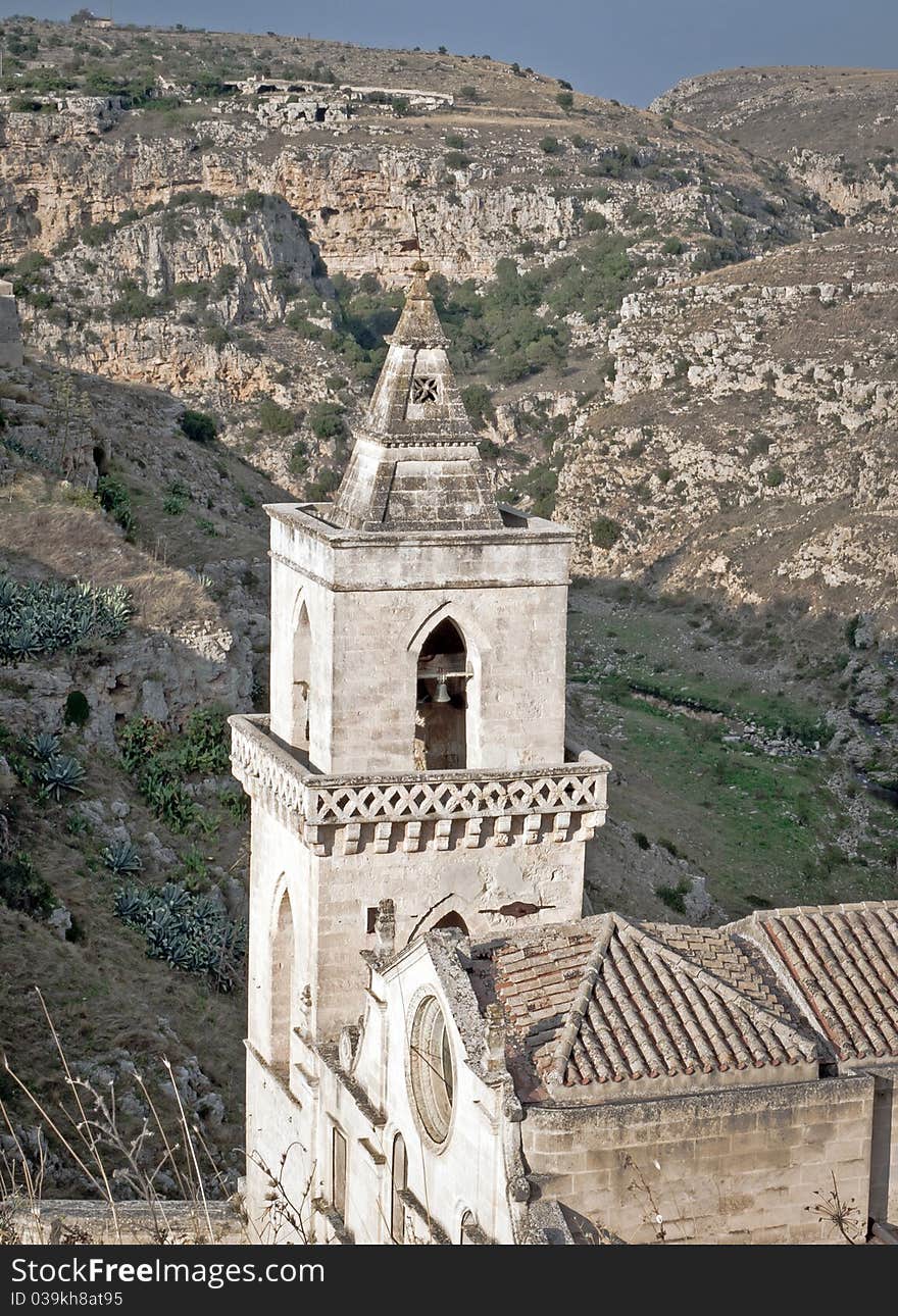 Church tower between the mountain in south Italy