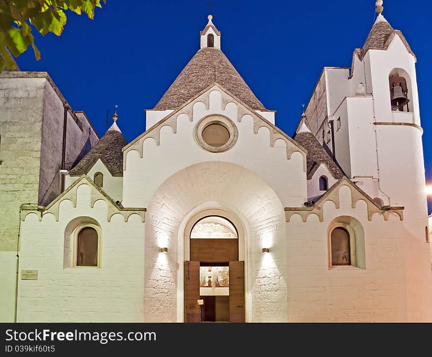 Illuminated church with special historical roof at