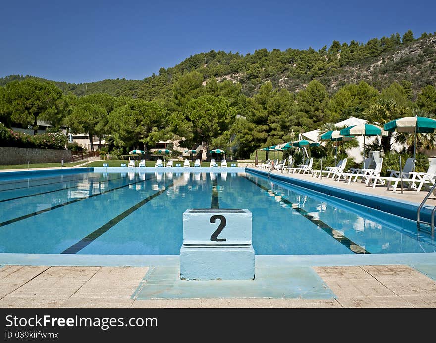 Swimming pool in the sunny sunshine