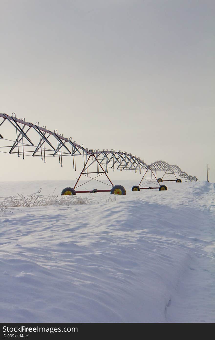 This image of the irrigation systme in the field was taken in NW Montana during a foggy winter early morning. This image of the irrigation systme in the field was taken in NW Montana during a foggy winter early morning.