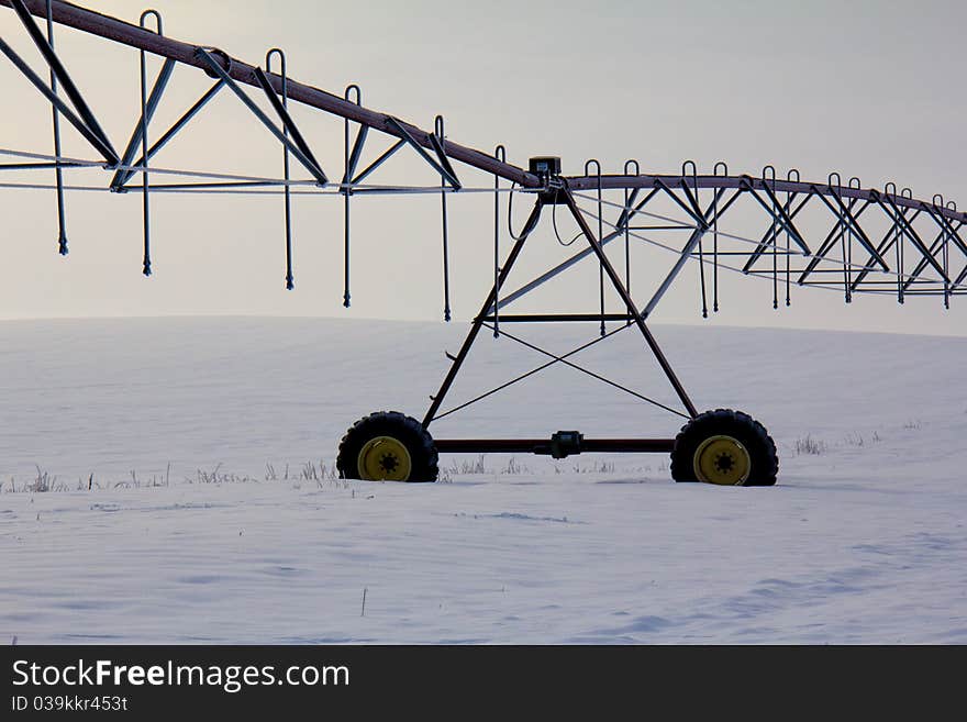 This image of the irrigation systme in the field was taken in NW Montana during a foggy winter early morning. This image of the irrigation systme in the field was taken in NW Montana during a foggy winter early morning.