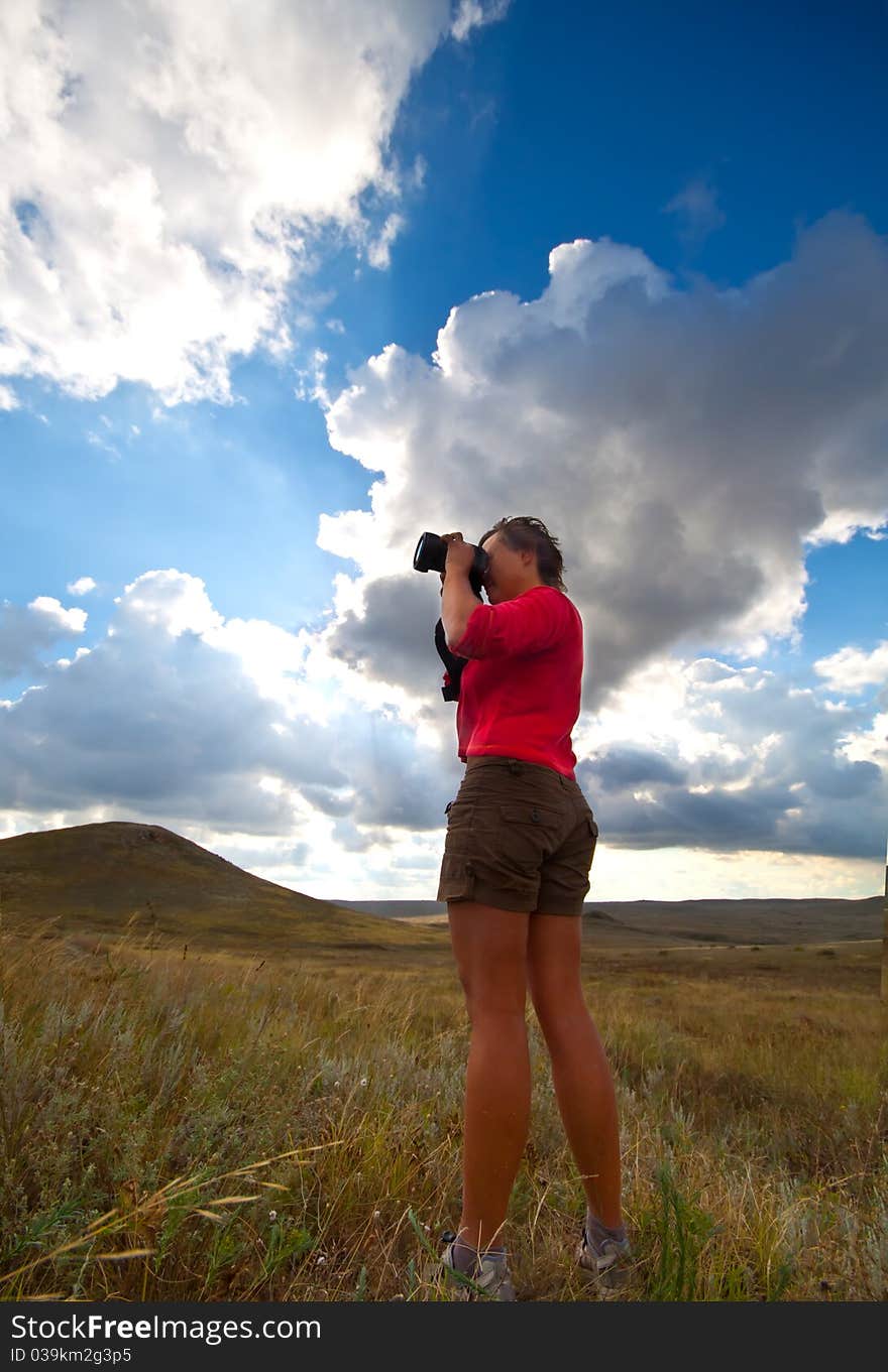 Girl taking picture on natural background. Girl taking picture on natural background