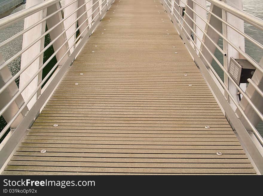 Horizontal view of a dock ramp with metal railings. Horizontal view of a dock ramp with metal railings.