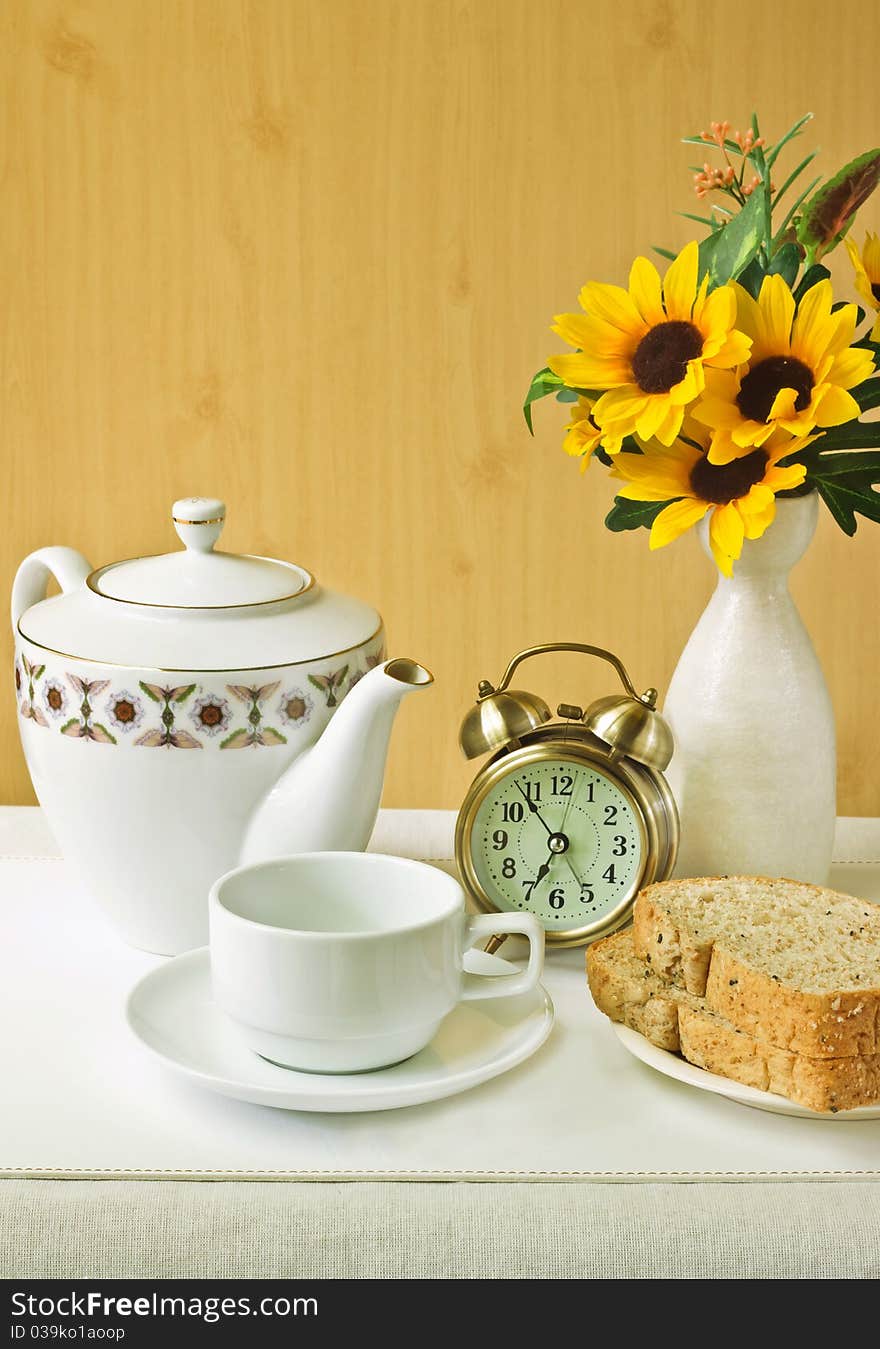 Alarm clock with cup and breads. Alarm clock with cup and breads