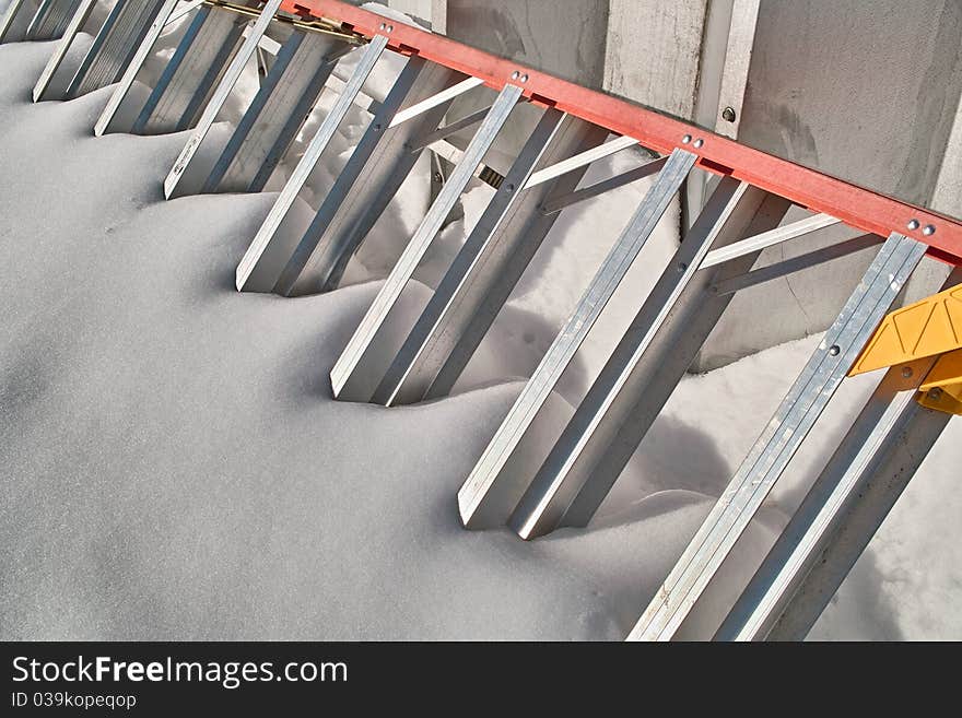 Abstract of ladder in snow.