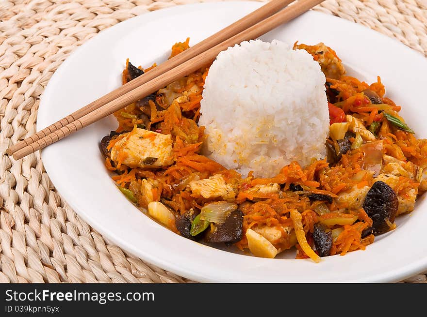 Chinese food with rice on a plate