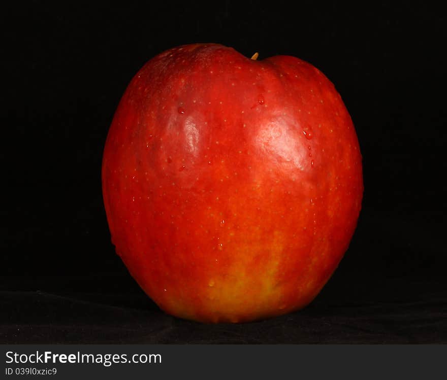 One organically grown apples isolated on Black