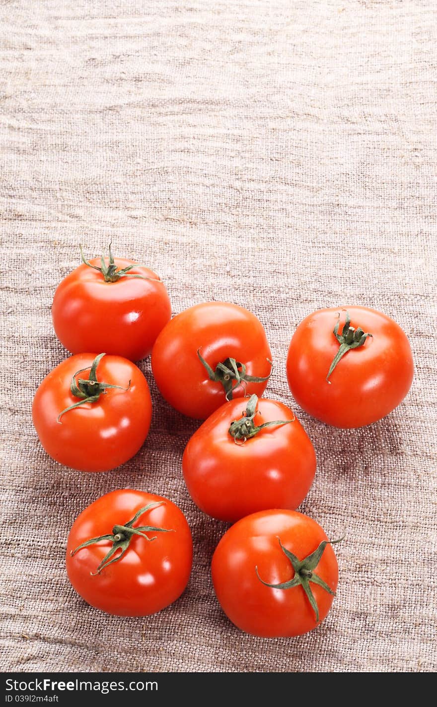 Tomato on a old fabric. Close-up