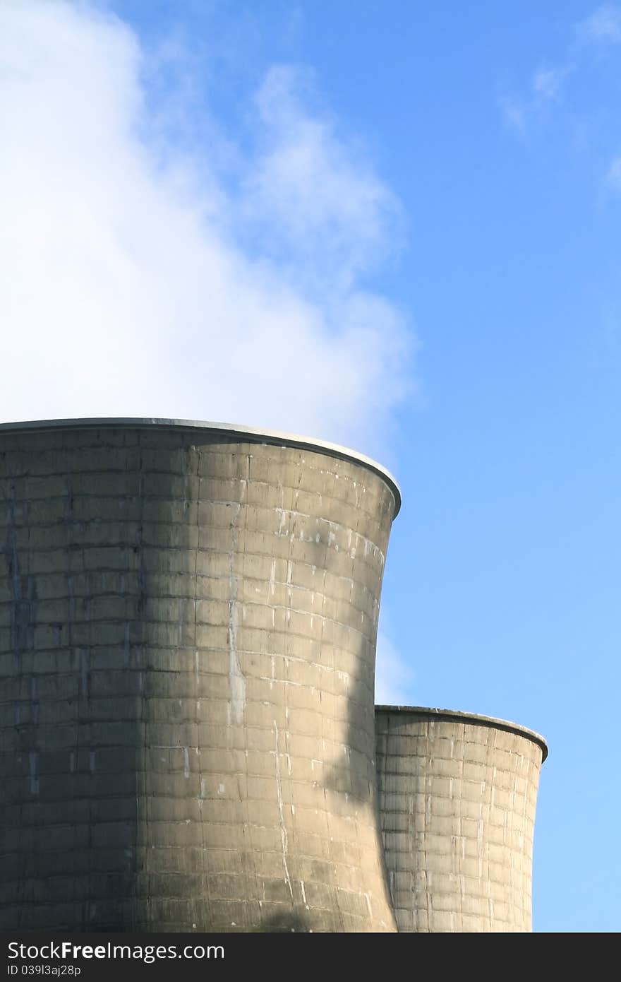 A close up shot of factory chimneys. A close up shot of factory chimneys