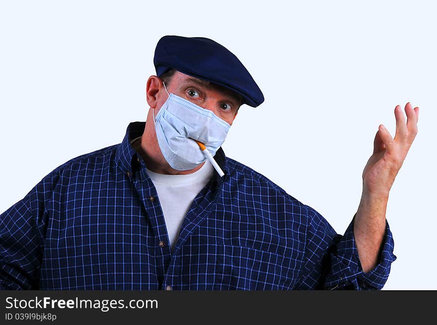 Man using a breathing mask is confused if he should smoke a cigarette or not, even though the mask will not help to filter out the carcinogens. Man using a breathing mask is confused if he should smoke a cigarette or not, even though the mask will not help to filter out the carcinogens.