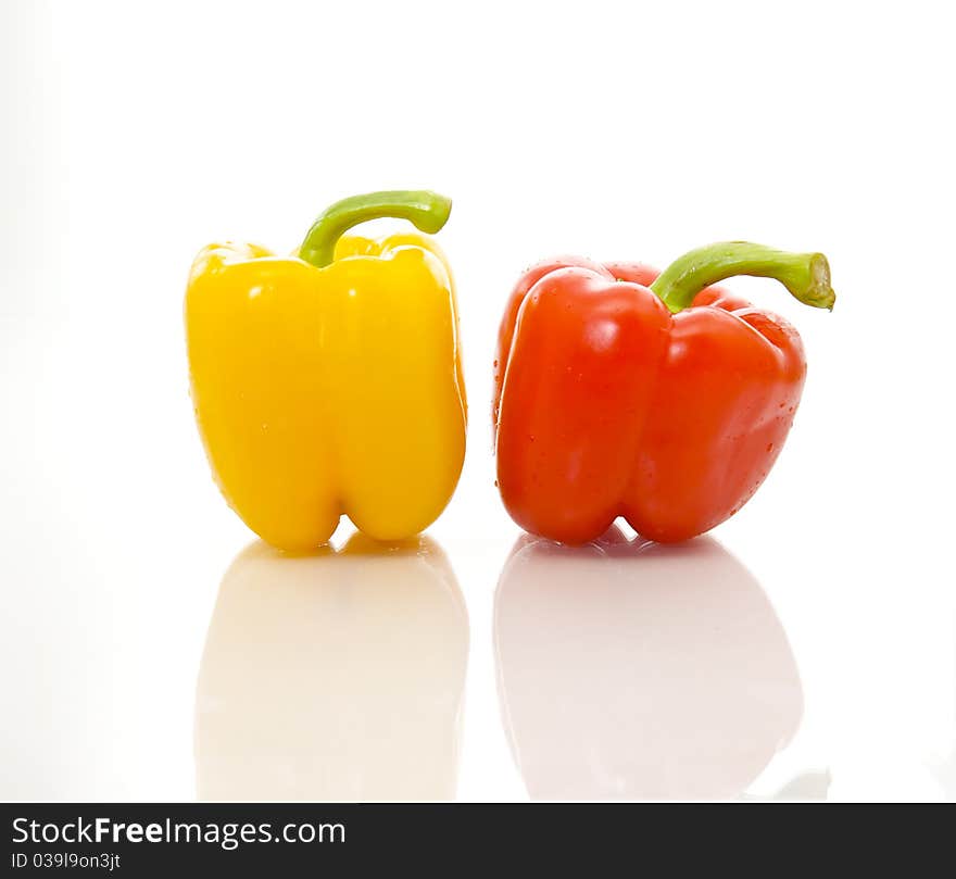 Isolated image of organic and healthy red and yellow bell peppers.