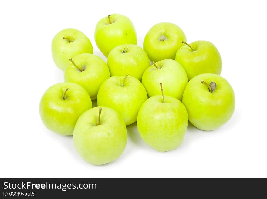 Green and yellow apples on a white background