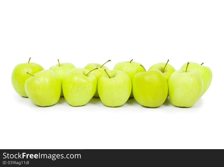 Green and yellow apples on a white background