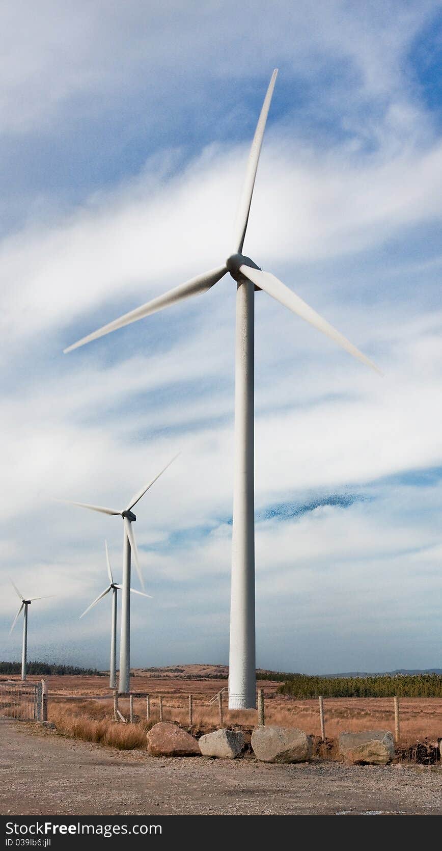 Windmills against blue sky