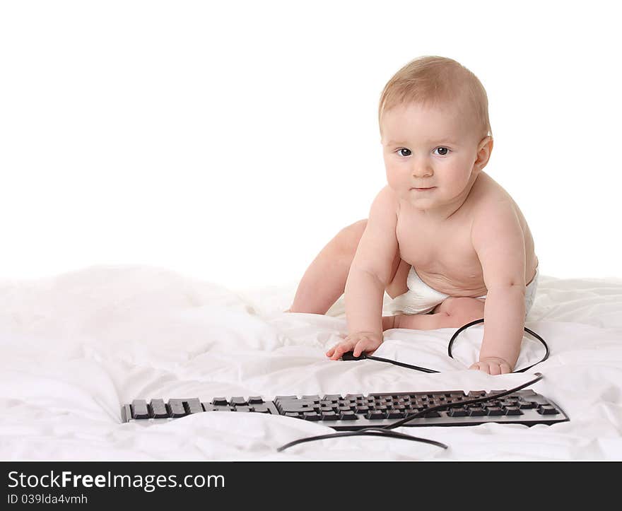 Cute baby with pc keyboard isolated on white