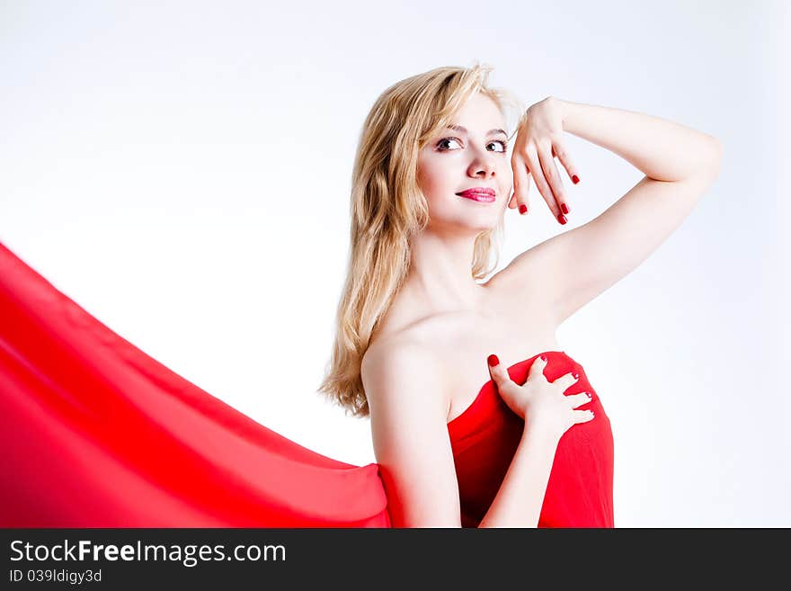 Red, beautiful blonde in a red dress