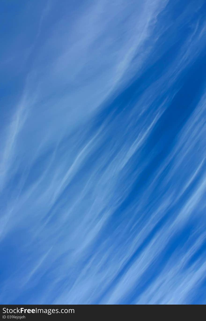 Wispy clouds on a deep blue sky