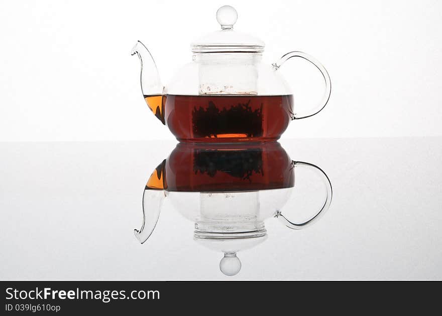 Glass transparent teapot on a white background. Glass transparent teapot on a white background