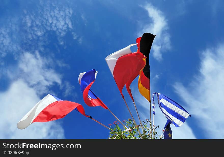 Flags of several Europe states against picturesque cloudy sky. Flags of several Europe states against picturesque cloudy sky