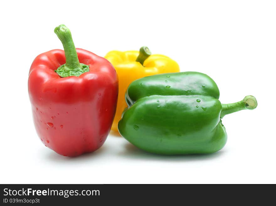 Close up of red, yellow and green pepper isolated on white background. Close up of red, yellow and green pepper isolated on white background.