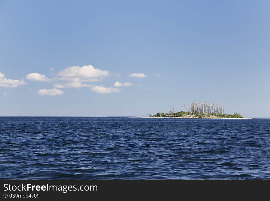 A view of one of the islands that make up the locally famous Four Brothers Islands group in the middle of Lake Champlain. The islands are one of the most productive places for fisherman to catch Lake Trout and Salmon. A view of one of the islands that make up the locally famous Four Brothers Islands group in the middle of Lake Champlain. The islands are one of the most productive places for fisherman to catch Lake Trout and Salmon.