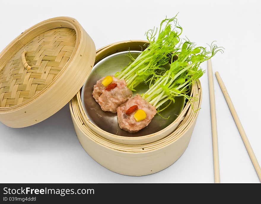 Chinese steamed dimsum in bamboo containers traditional cuisine. Chinese steamed dimsum in bamboo containers traditional cuisine