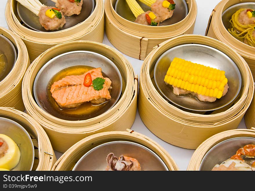 Chinese steamed dimsum in bamboo containers traditional cuisine. Chinese steamed dimsum in bamboo containers traditional cuisine