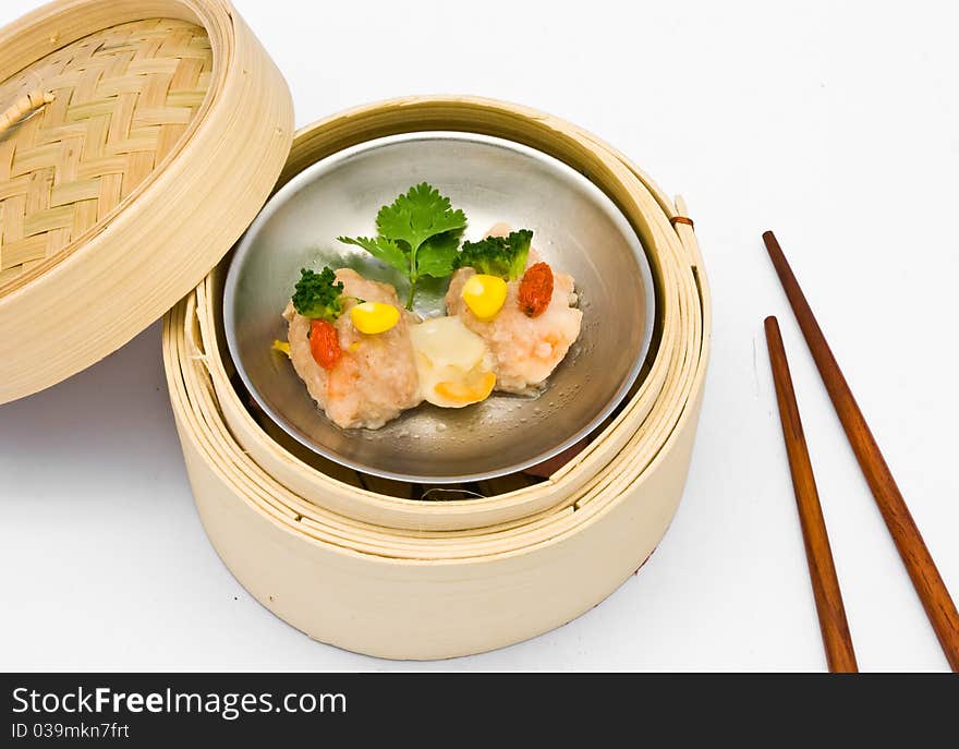 Chinese steamed dimsum Scallops in bamboo containers traditional cuisine