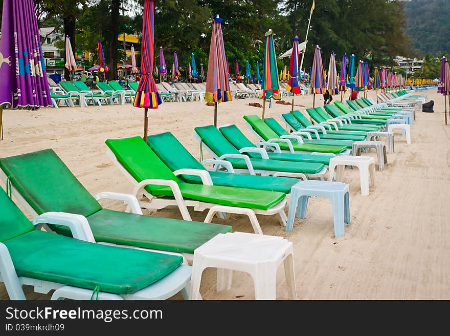 Empty Chaise Lounges On A Beach