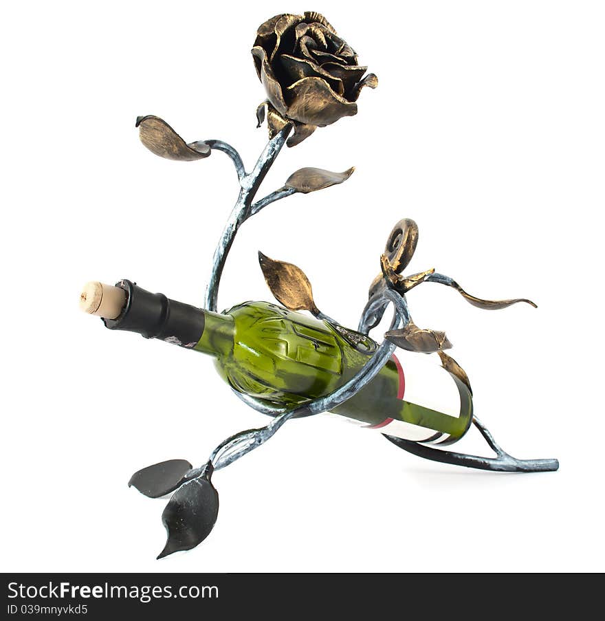 Metal rose and a bottle of wine on a white background