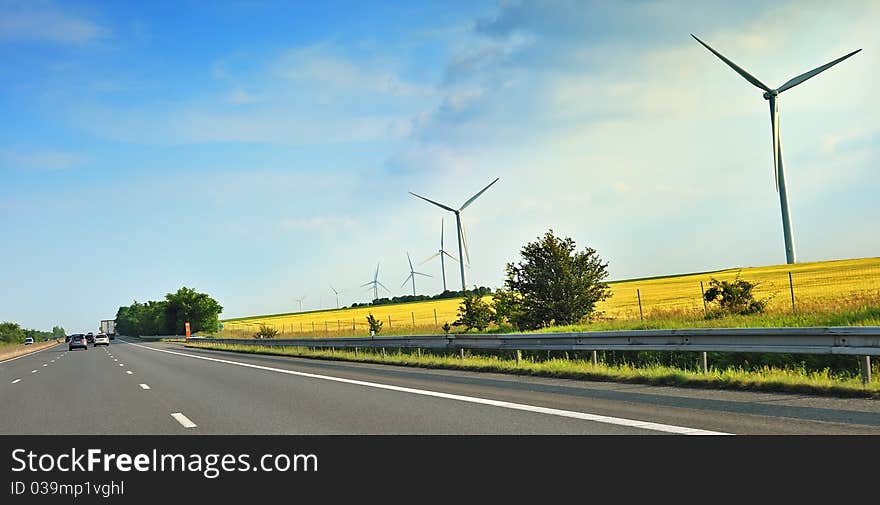 Wind turbines along a freeway