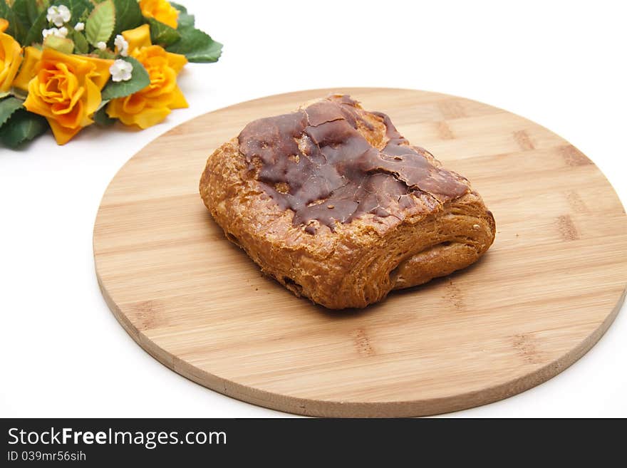 Pastry with chocolate and flowers