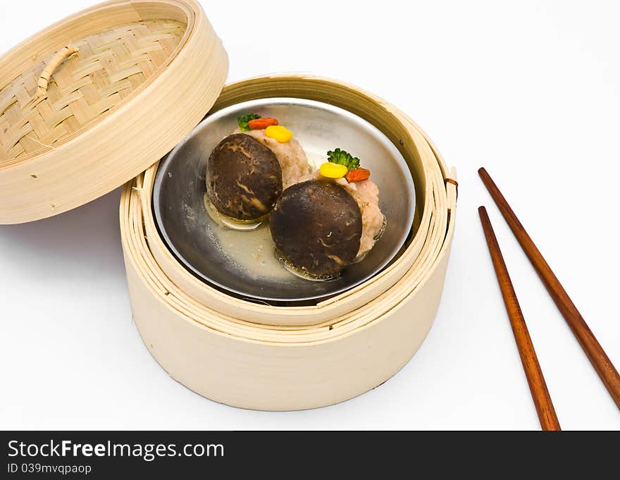 Chinese steamed dimsum Mushrooms in bamboo containers traditional cuisine