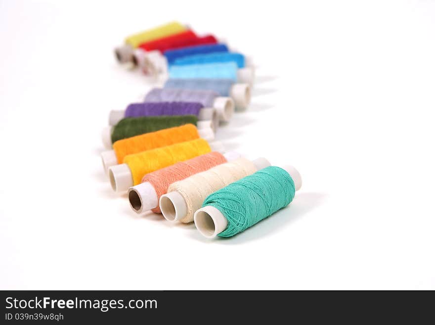 Colored thread on a white background. Colored thread on a white background.