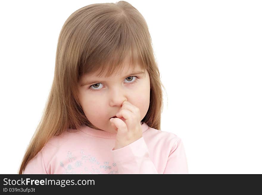 Little girl is picked in a nose on white