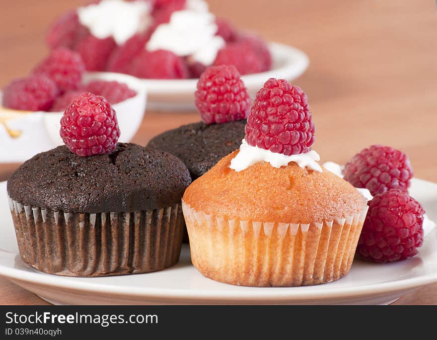 Yellow and brown muffins with raspberry