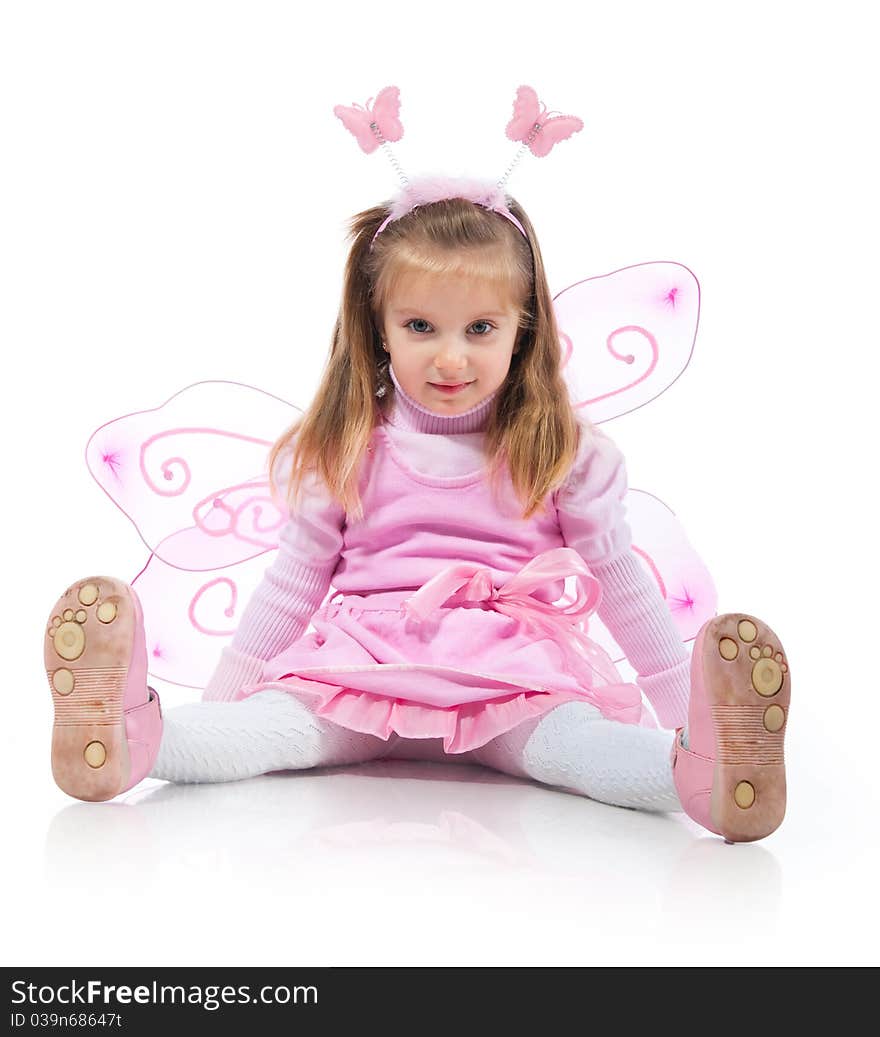 Little girl in fairy costume on white background