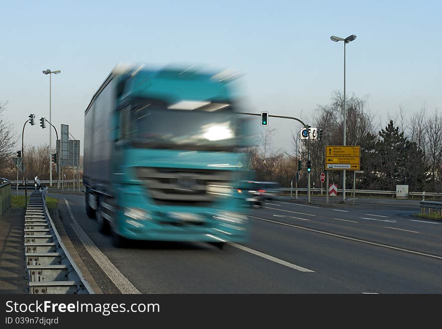 Truck moving at high speed on a country road. Truck moving at high speed on a country road