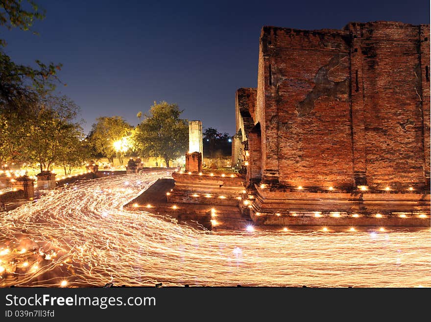 Candle light trail of Buddhism Ceremony at temple ruin on Asalha Puja day