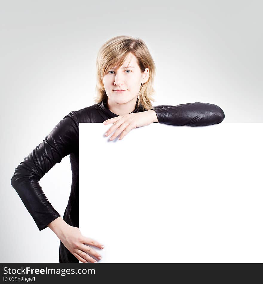 Young attractive woman and empty white board