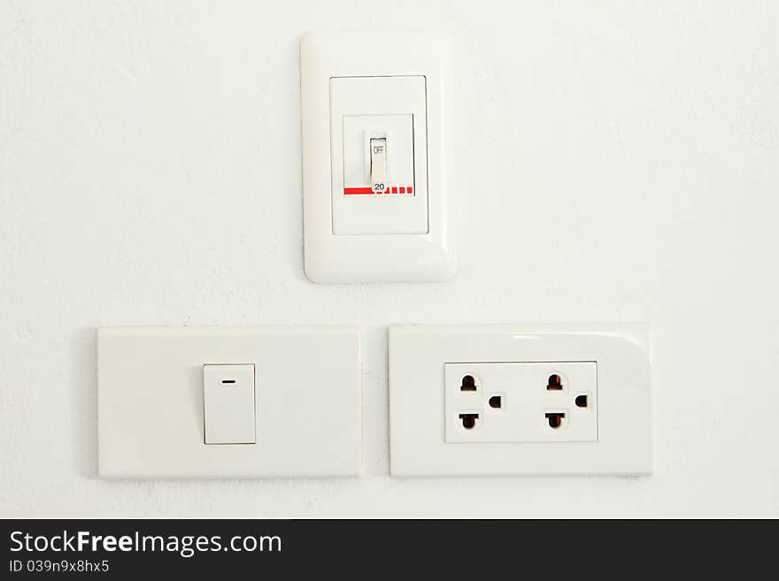 Three type electric switch on white wall. Three type electric switch on white wall.