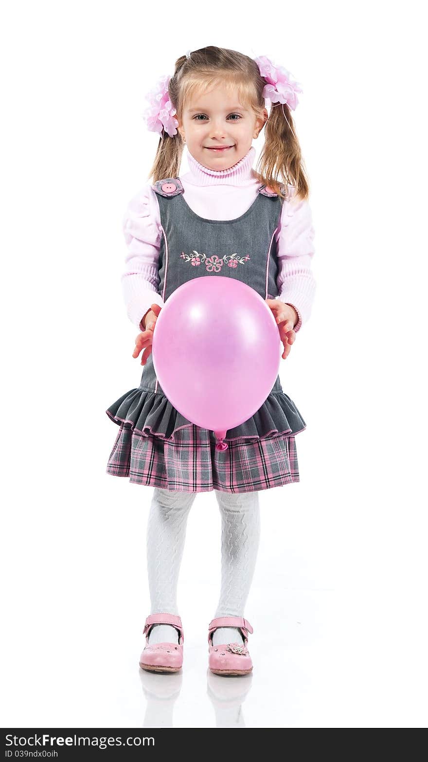 Pretty little girl with balloon over white