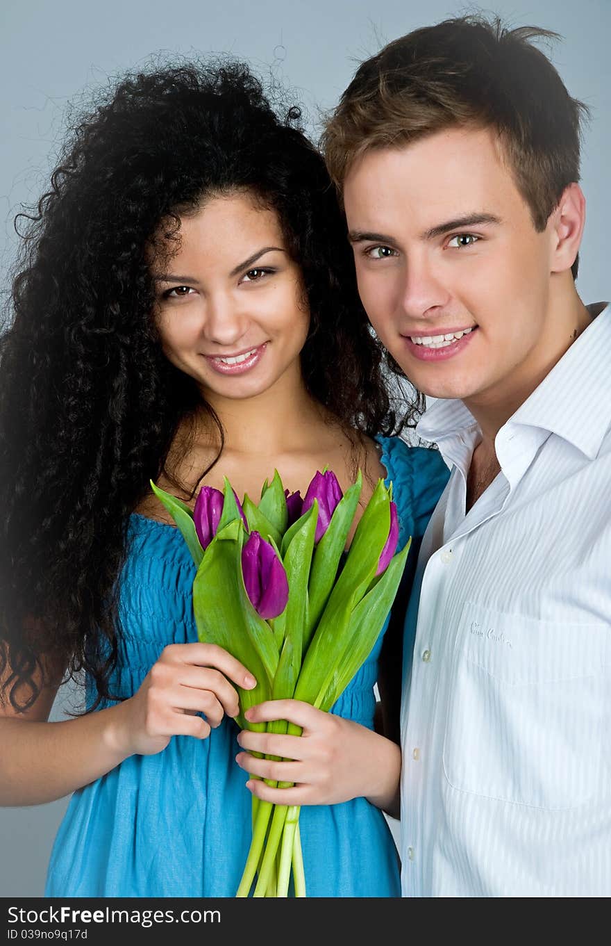 Young couple over blue background