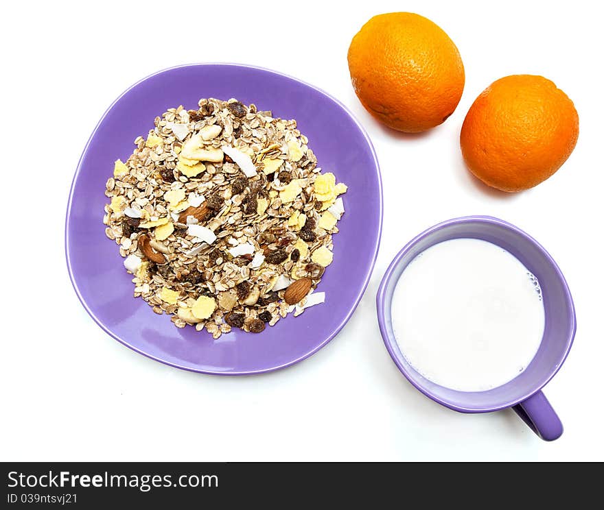 Muesli, milk and oranges isolated on white. Muesli, milk and oranges isolated on white