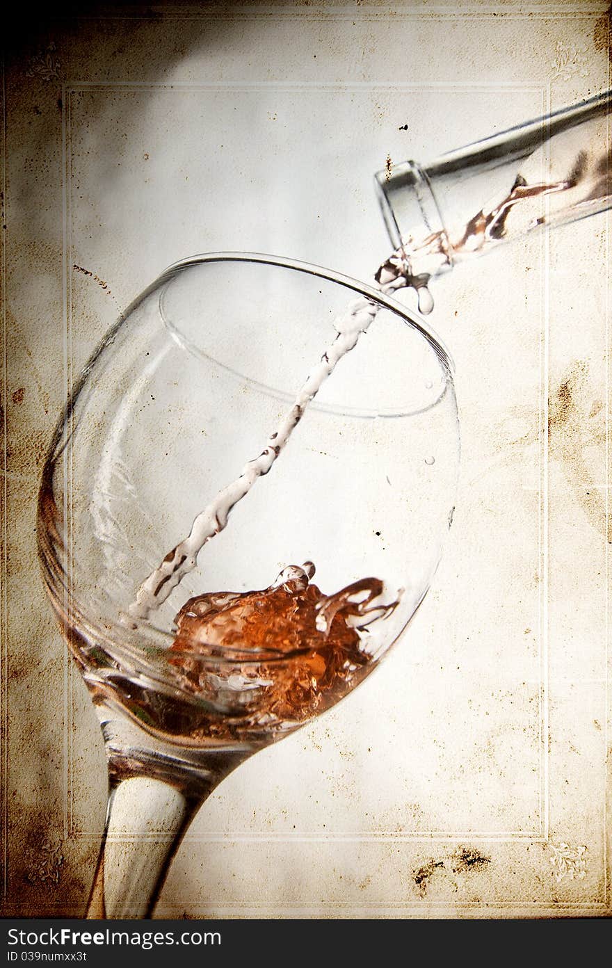 Pouring red vine in glass on vintage background