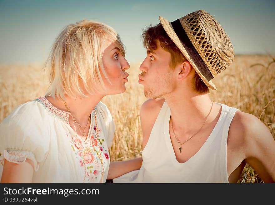 Image Of Young Man And Woman On Wheat Field