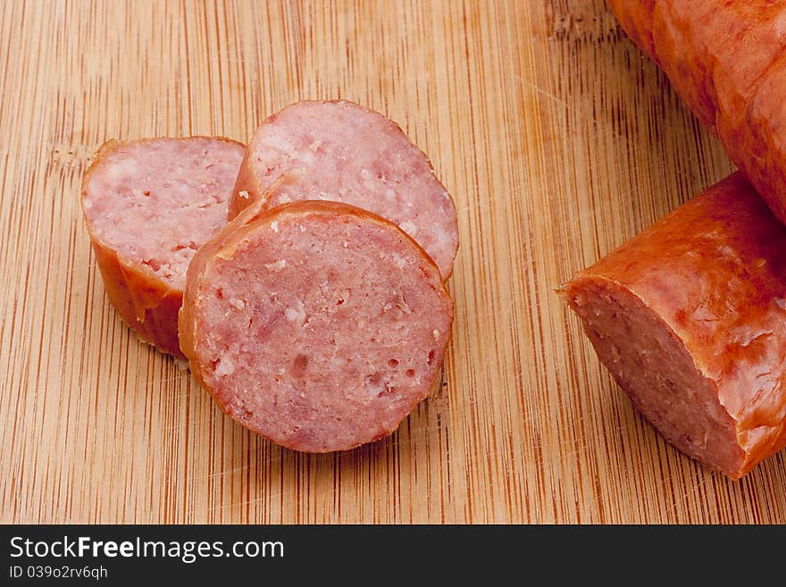 Fatty home smoked sausage on the kitchen blackboard.